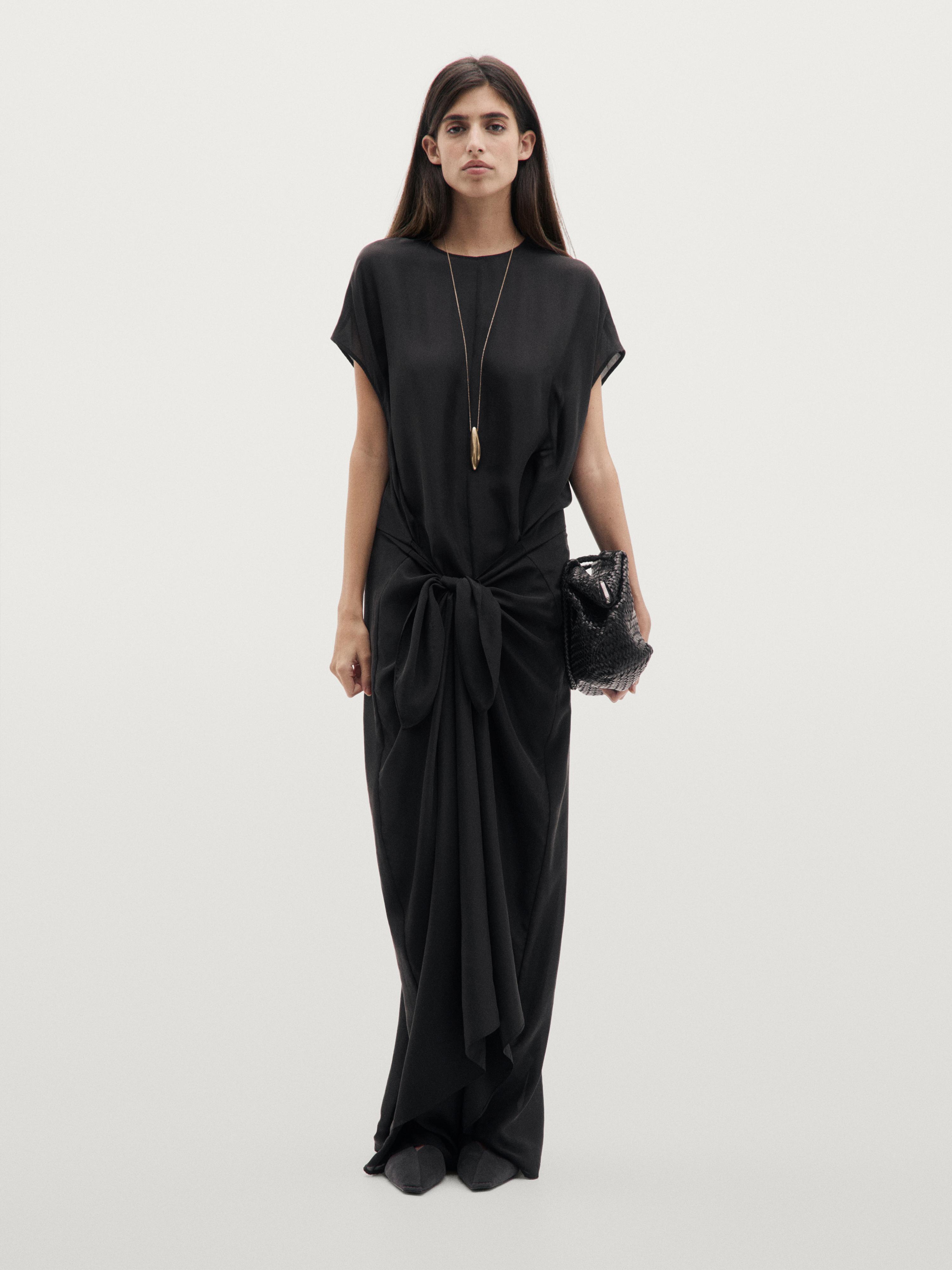 Flowing jumpsuit with knot detail